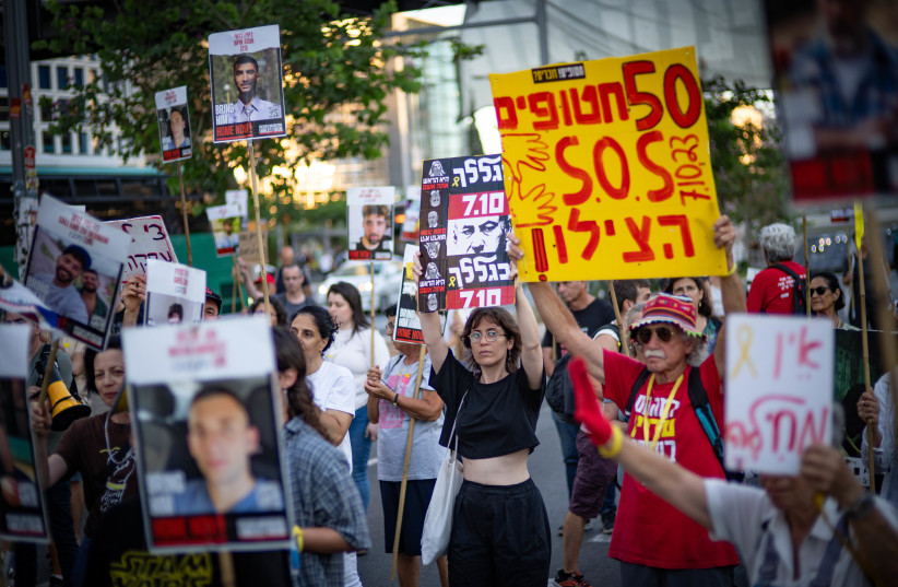  Demonstrators protest for the release of Israelis held hostage in the Gaza Strip, outside the IDF Kirya Military HeadquartersBase in Tel Aviv, July 2, 2025. (credit: ERIK MARMOR/FLASH90)