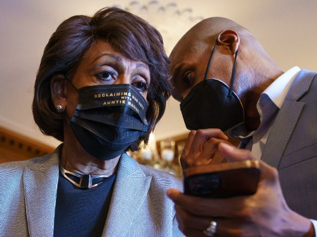 Rep. Maxine Waters, D-Calif., listens to an aide as she joins members of the Congressional Black Caucus to await the verdict in the murder trial of former Minneapolis police Officer Derek Chauvin in the death of George Floyd, on Capitol Hill in Washington, Tuesday, April 20, 2021. (AP Photo/J. Scott Applewhite)