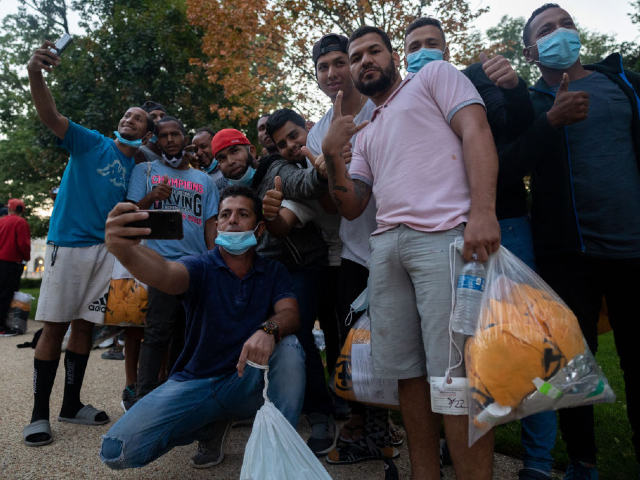 Washington, USA- August 26th: Immigrants celebrate after arriving in Washington, DC on the morning of August 26th, 2022 after being bussed across the country from Texas, at the order of Texas Governor Greg Abbott. (Photo by Nathan Posner/Anadolu Agency via Getty Images)