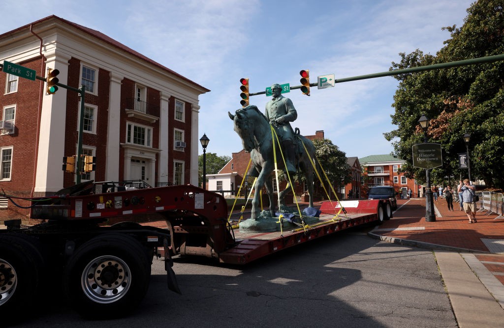 CHARLOTTESVILLE, VIRGINIA - JULY 10: A flatbed truck carries a statue of Confederate General Robert E. Lee away from the Market Street Park July 10, 2021 in Charlottesville, Virginia. Initial plans to remove the statue four years ago sparked the infamous “Unite the Right” rally where 32 year old Heather Heyer was killed. A statue of Confederate General Thomas 