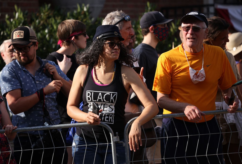 CHARLOTTESVILLE, VIRGINIA - JULY 10: Spectators watch as workers remove a statue of Confederate General Robert E. Lee from Market Street Park July 10, 2021 in Charlottesville, Virginia. Initial plans to remove the statue four years ago sparked the infamous “Unite the Right” rally where 32 year old Heather Heyer was killed. A statue of Confederate General Thomas 