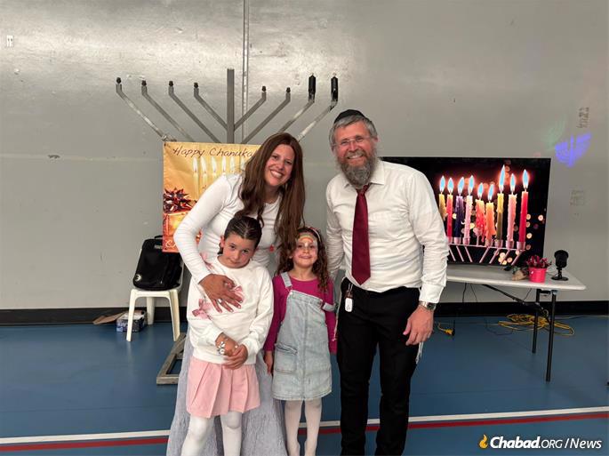 Rabbi Shalom and Odeya White and their children prepare for their now-indoor “Chanukah in the Park.”