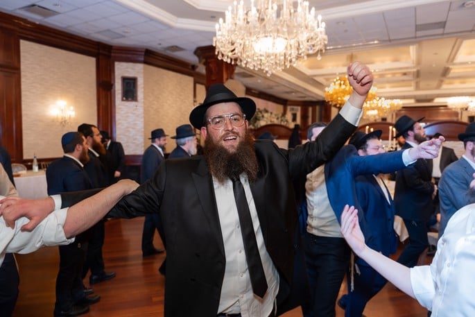 Chabad-Lubavitch emissary Rabbi Zvi Kogan dances at his wedding in 2022. - Yossi Fajnland