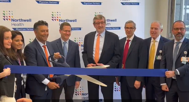 Michael Dowling (middle, with orange tie), the CEO of Northwell Health System is pictured here with Northwell officials at last week’s ribbon cutting ceremony that unveiled Concorde Cardiology at Park Avenue South in Manhattan.||