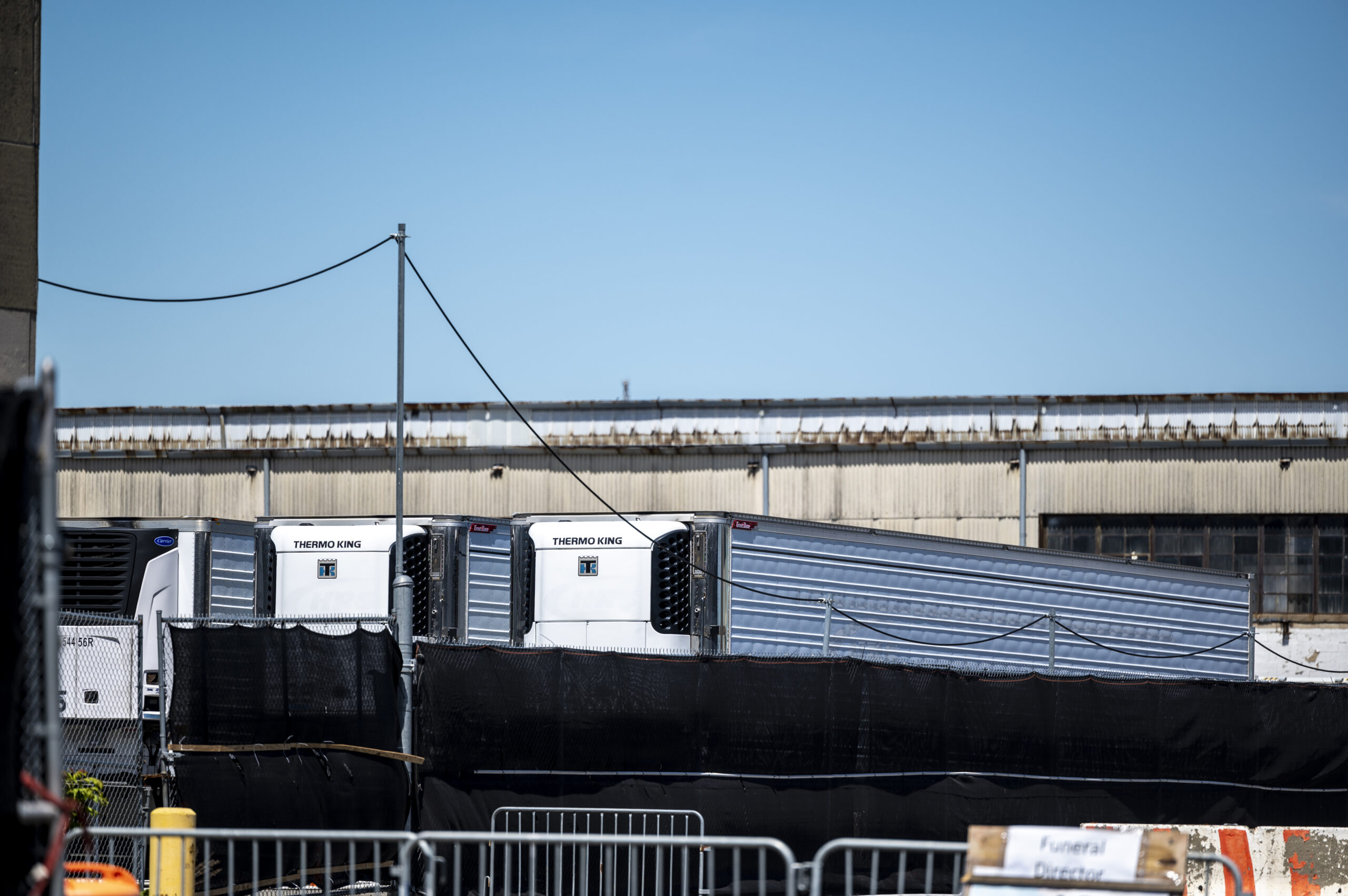 A fleet of refrigerated trucks storing the bodies of people who died of COVID-19 sits near the Brooklyn waterfront in Sunset Park on Thursday, May 6, 2021.