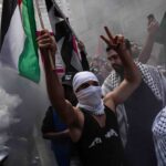 Britain says it is suspending some arms exports to Israel over risk of breaking international law