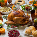 A cafeteria worker prepares a Thanksgiving meal to feed hundreds