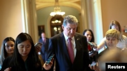 Sen. Joe Manchin, D-W.Va., speaks to reporters before attending a meeting on infrastructure on Capitol Hill in Washington, June 23, 2021.