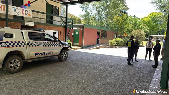 Police stationed at the Camp Gan Israel campground.