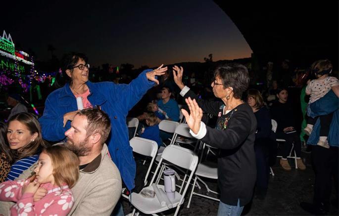 Super's menorah lighting draws a diverse crowd of Jews eager to celebrate their Judaism in public.