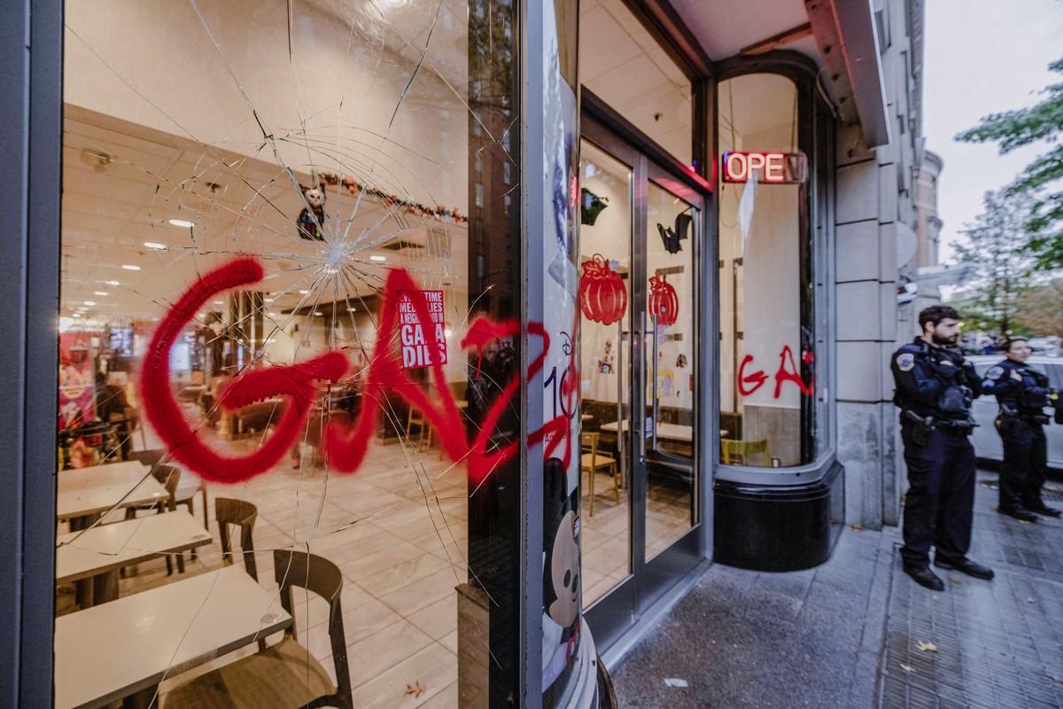  'Gaza' is sprayed on a broken McDonald's window during a pro-Palestinian demonstration in Freedom Plaza, Washington, on Nov. 4, 2023. (ALI KHALIGH/Middle East Images/AFP via Getty Images)