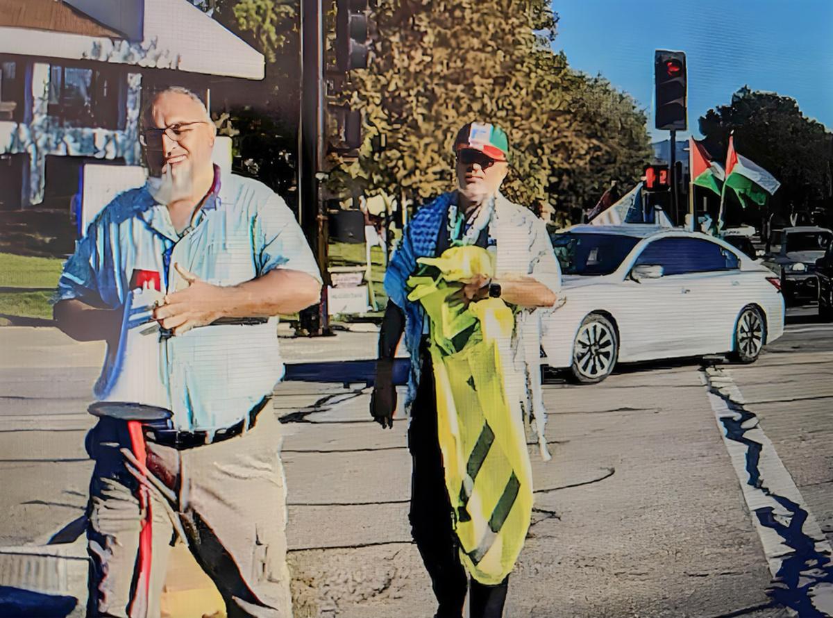  Loay Alnaji (L) the alleged suspect in the death of 69-year-old Paul Kessler, a Jewish man, carries a megaphone in Thousand Oaks, Calif., on Nov. 5, 2023. (Courtesy Of Jonathan Oswaks)
