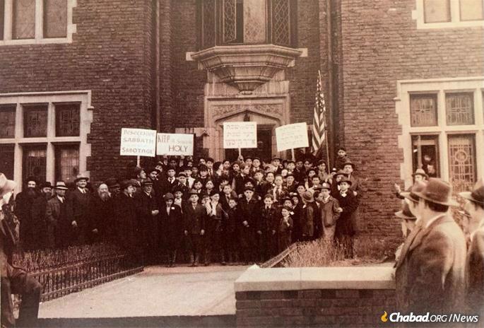 A Mesibos Shabbos-organized march in support of Shabbat observance forms outside of Chabad headquarters at 770 Eastern Parkway in the Crown Heights neighborhood of Brooklyn, N.Y., circa 1940s.