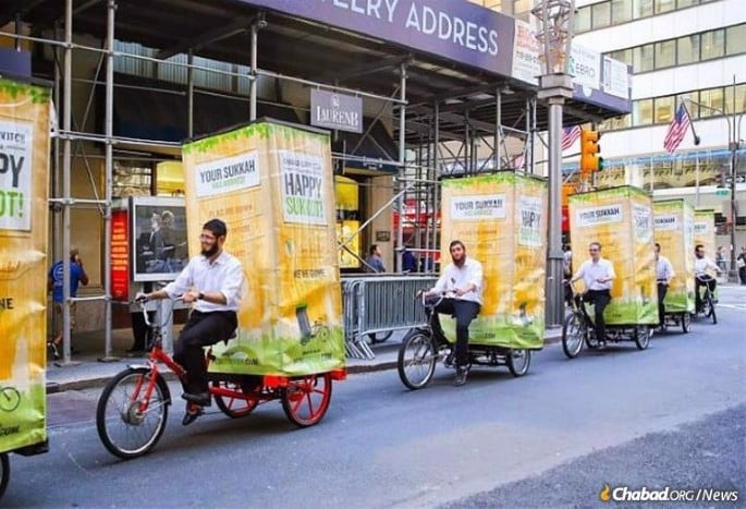 A fleet of pedi-sukkahs bringing mitzvahs to people's doorsteps