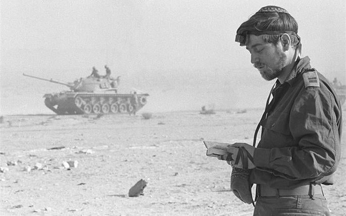 A soldier prays during the Yom Kippur War. - Photo courtesy IDF Spokesperson's Unit.