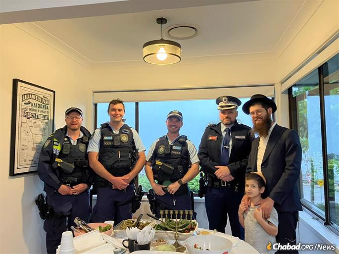 Menachem Aron with police.