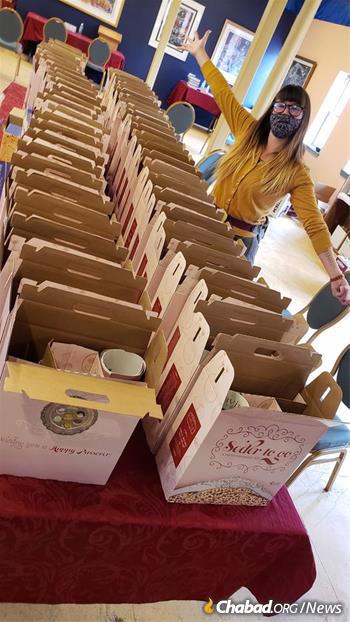 Volunteer Liv Orovitch helps pack and distribute Seder-to-Go kits this year at Chabad of Santa Fe, New Mexico. (Credit: Chabad of Santa Fe)