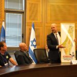 OAN Fires Producer Vish Burra After Antisemitic AI Cartoon Targets Jewish Individuals, Sparks Nationwide Backlash